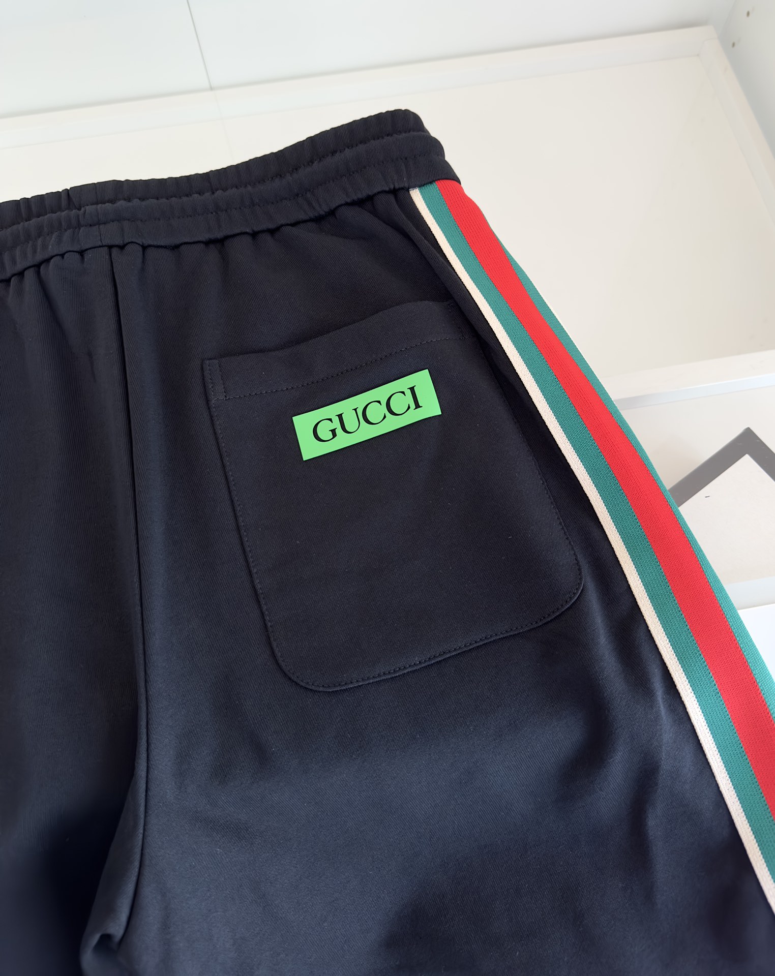 Replica Gucci red and green webbed shorts on both sides