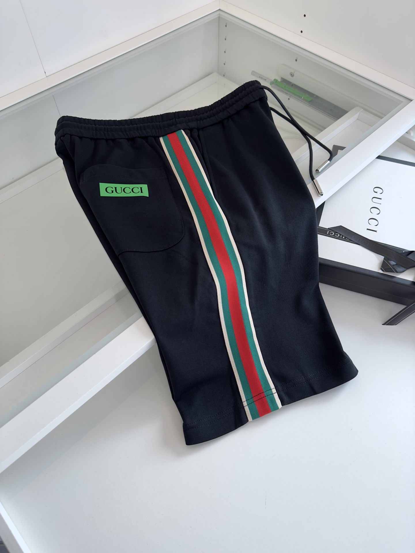 Replica Gucci red and green webbed shorts on both sides